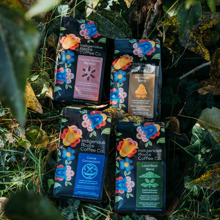 Indigenous Roots Coffee Co. packages on a natural background with leaves